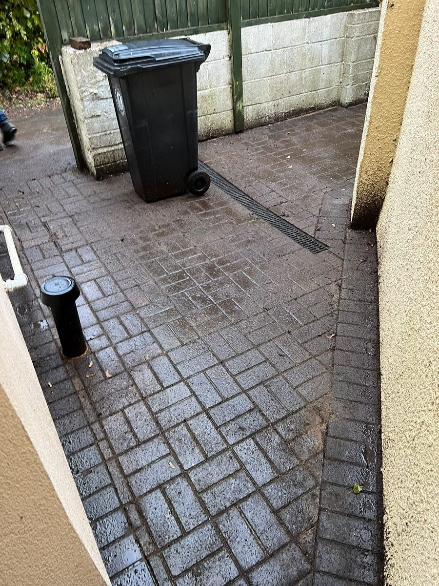 Hengrove side passage after garden clearance, with the paving and drain channel clear